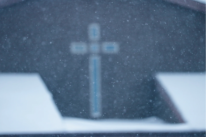 a faded image of a cross, a symbol of spirituality for christians.