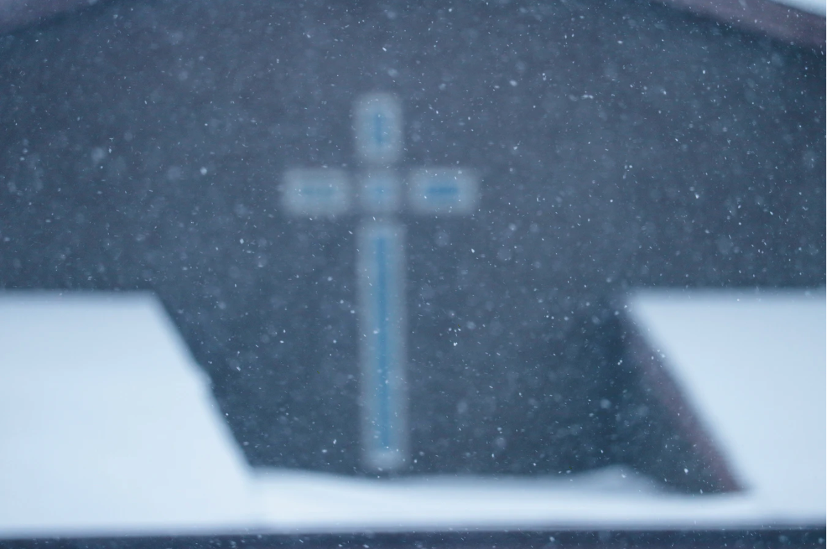 a faded image of a cross, a symbol of spirituality for christians.